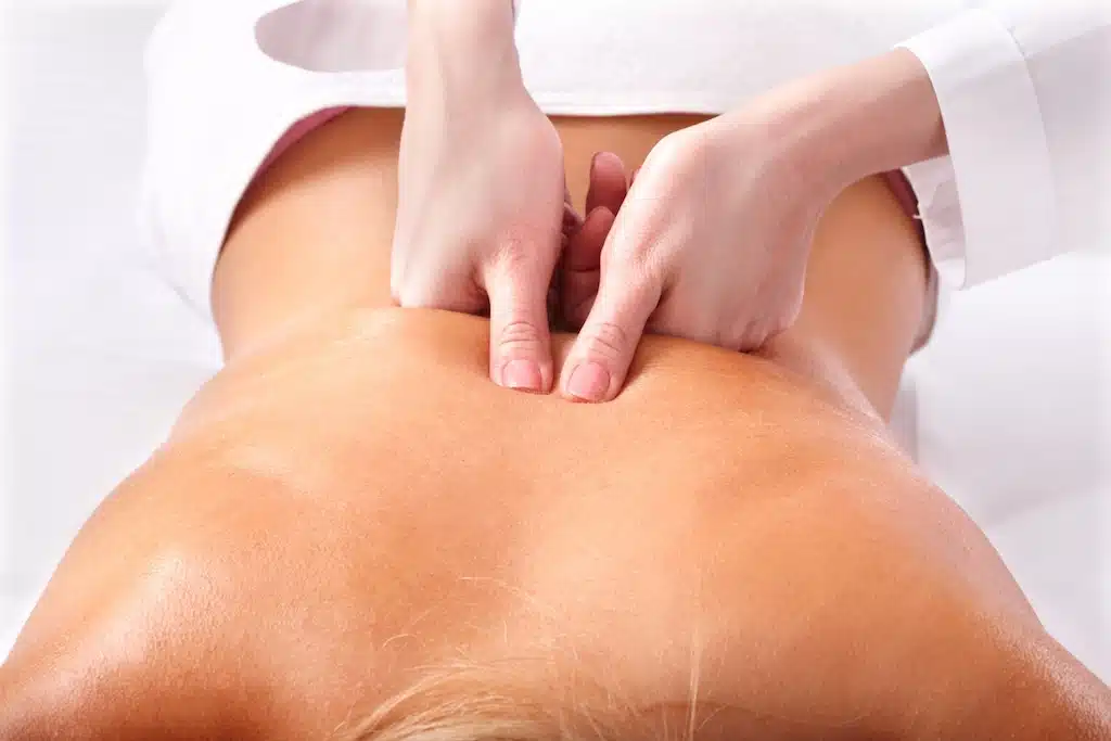 Patient receiving medical massage as part of our multidisciplinary approach to pain relief and wellness